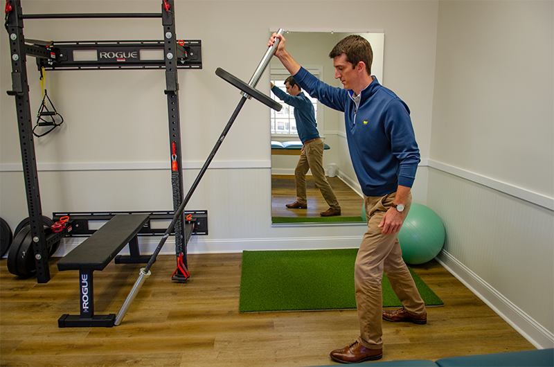 Mac McLaurin with equipment in his Pinehurst office